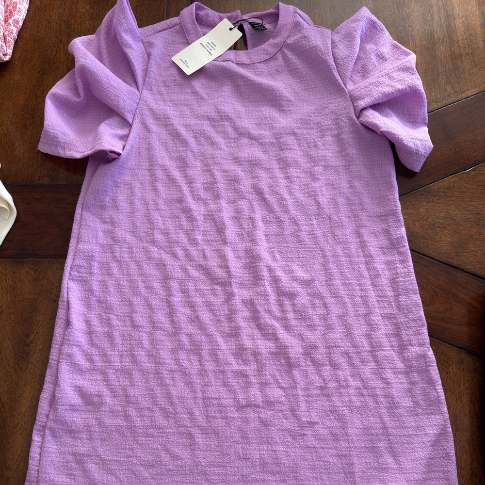 Beautiful purple dress. Never worn with tags.